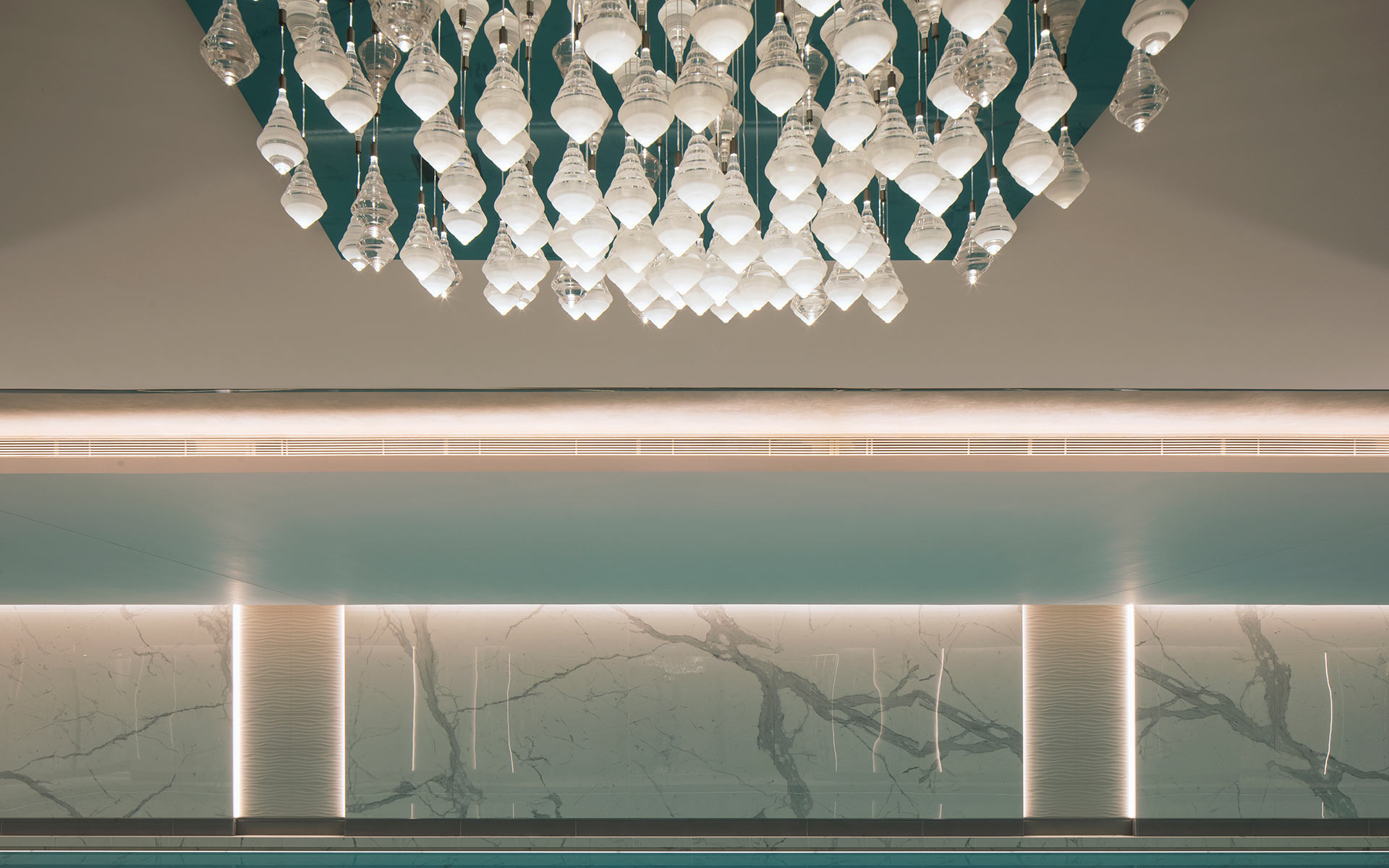 Striking Chandelier Suspended Droplets Cluster Reflective Ceiling Plate Luxury Spa Swimming Pool London Bespoke Lighting Designers Nulty Bespoke