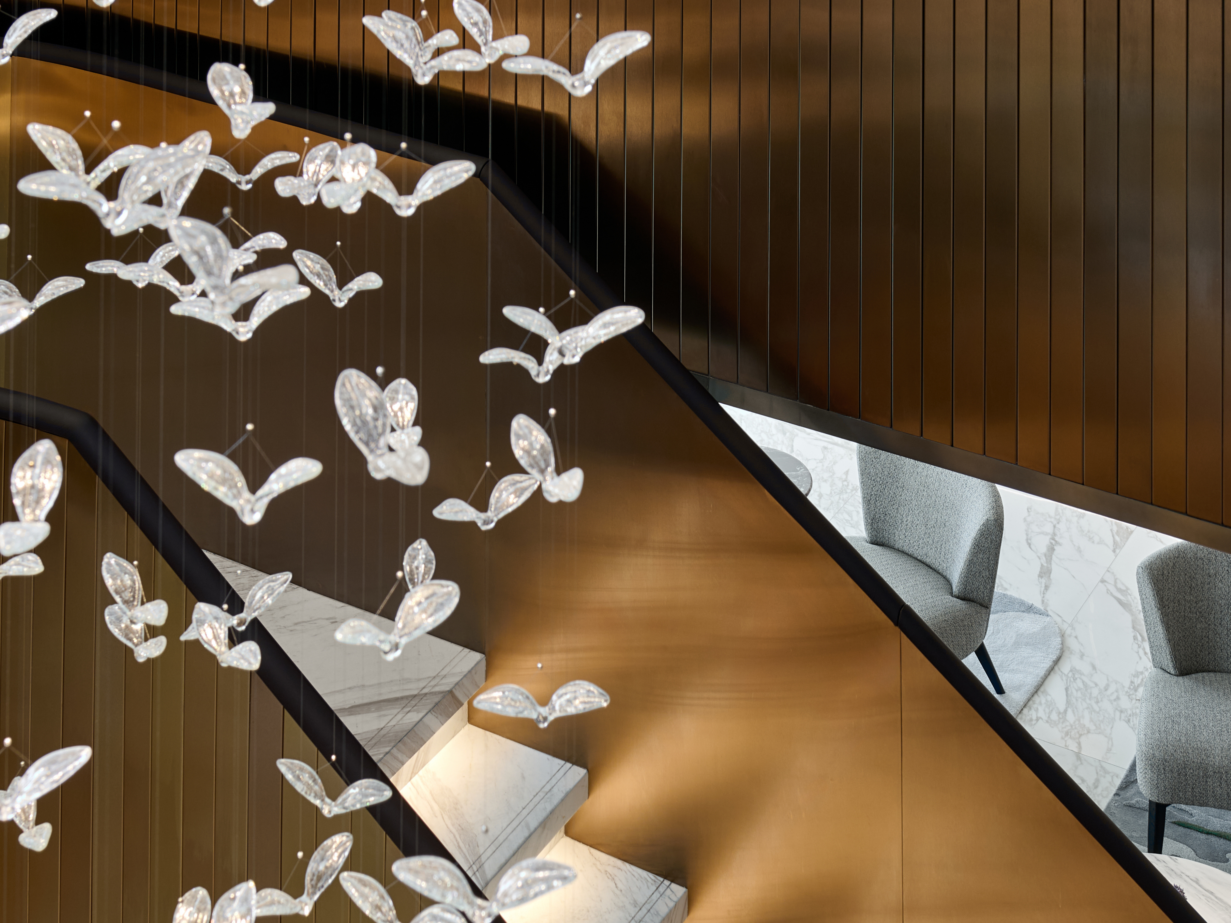 Close up of glass birds in staircase