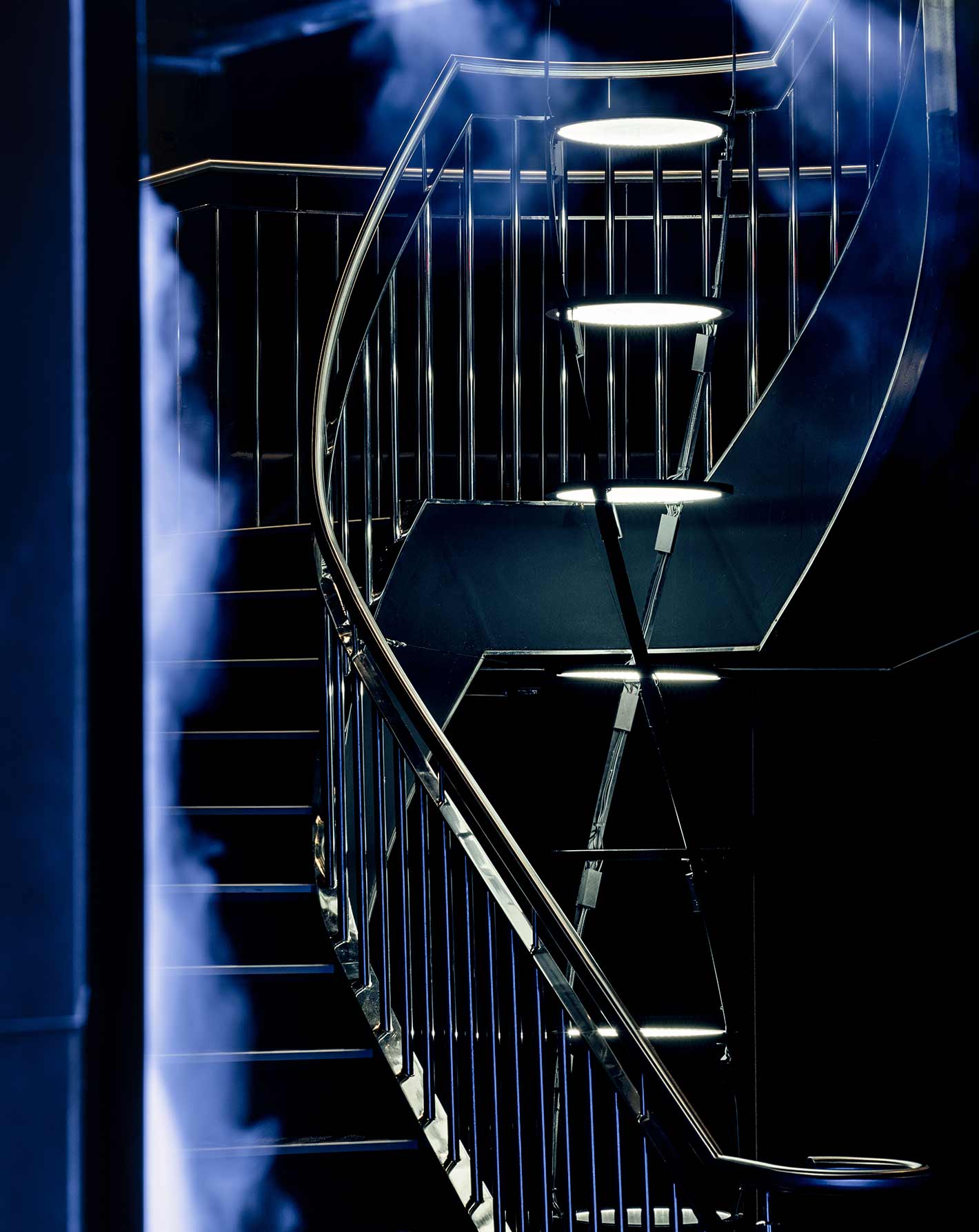Park Row Restaurant Soho Stairwell Lighting Installation Tiered Illuminated Discs Helix Twisting Structure Mist Wall Designers Nulty Bespoke